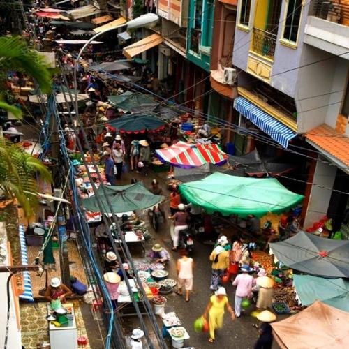 Continue the walk through crowded market alleys.